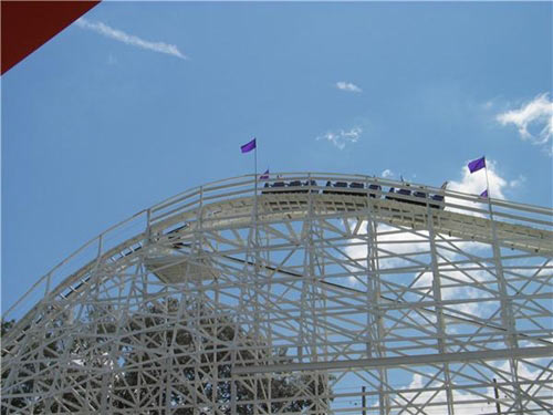 rollercoaster at apex of a hill